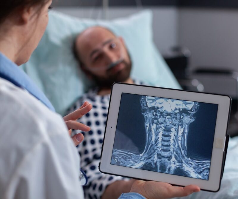 Physician examining digital x-ray