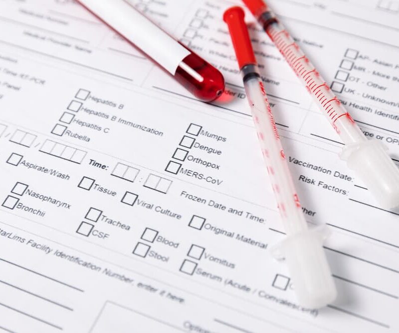 medical report with tubes of blood