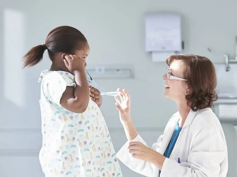 Girl Listening to Doctors Stethoscops