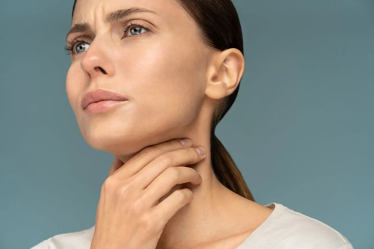 woman having a sore throat